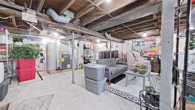 unfinished basement featuring water heater and heating unit