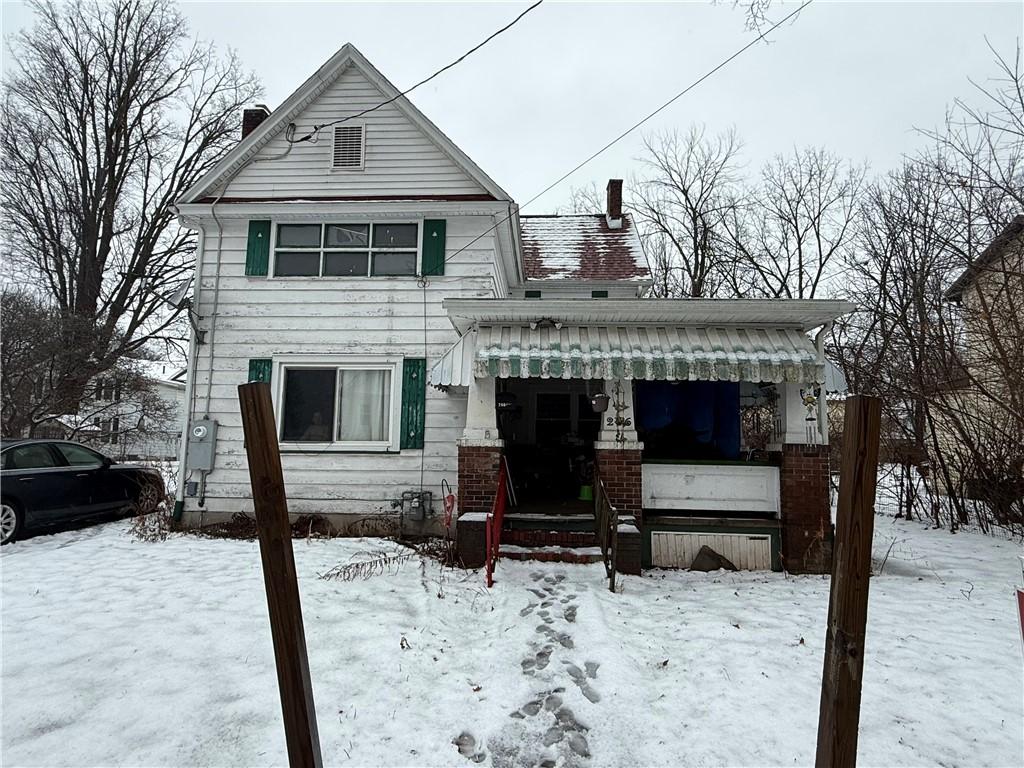 view of front of home featuring a chimney