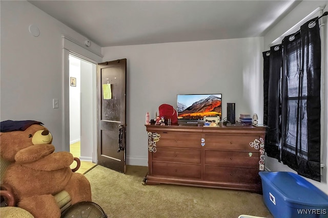 sitting room with carpet flooring and baseboards