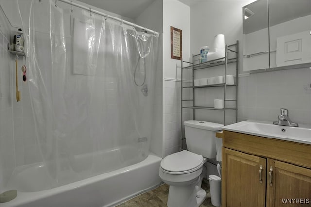 full bath featuring toilet, shower / tub combo, tile walls, and vanity