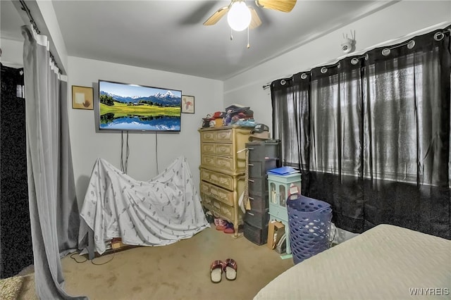 bedroom featuring ceiling fan and carpet flooring