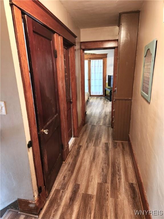 corridor with dark wood finished floors