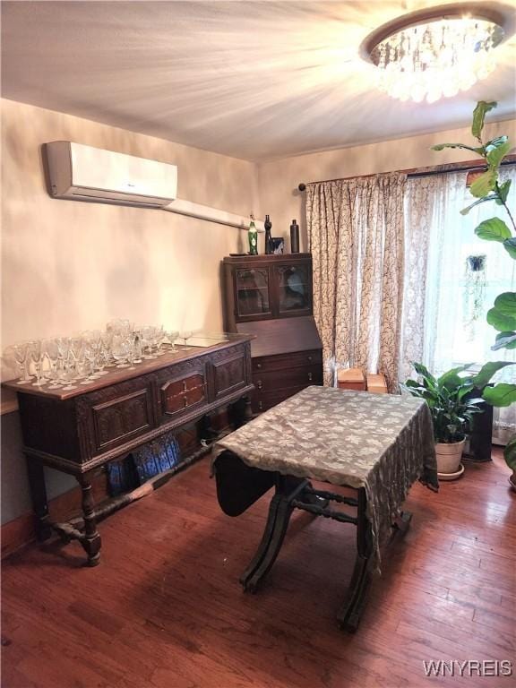 interior space featuring a wall mounted air conditioner and wood-type flooring