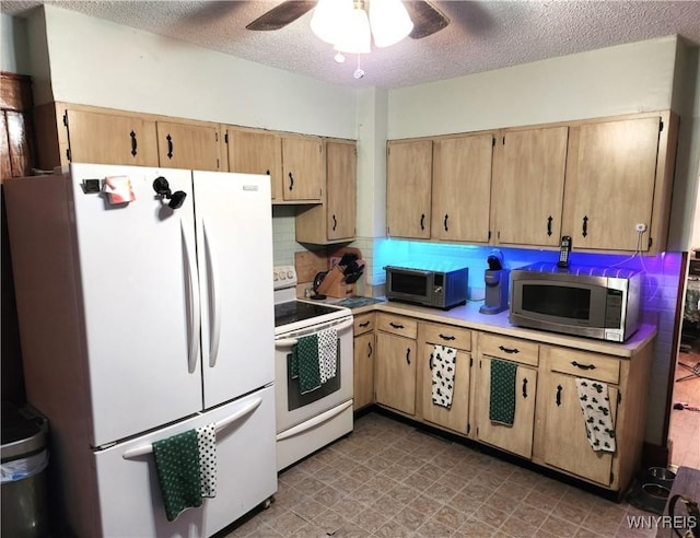 kitchen with white appliances, a ceiling fan, light countertops, a textured ceiling, and backsplash