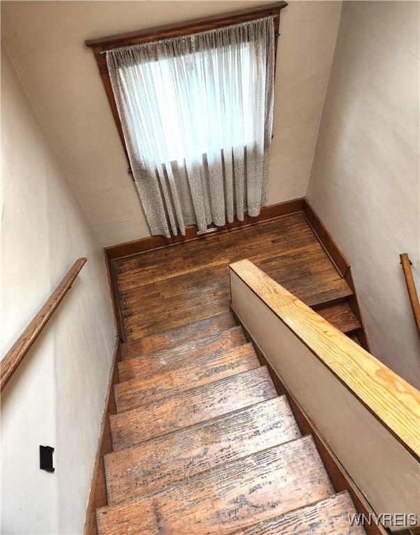 stairs with wood finished floors