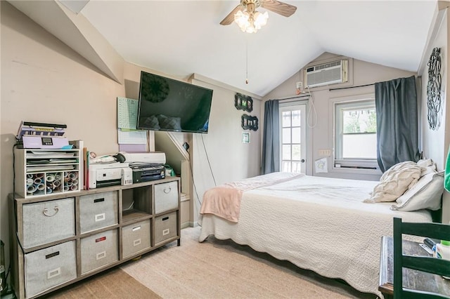 bedroom featuring vaulted ceiling, a wall mounted AC, light carpet, and a ceiling fan