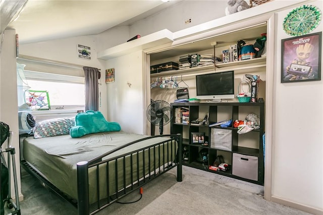 bedroom featuring carpet floors and lofted ceiling