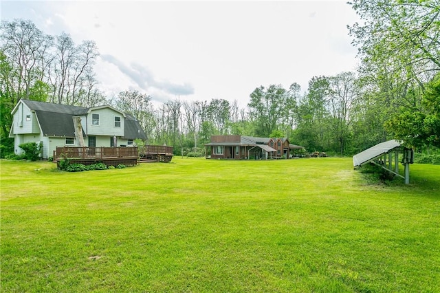 view of yard featuring a deck