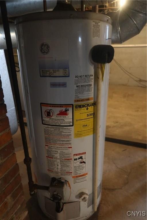 utility room featuring water heater