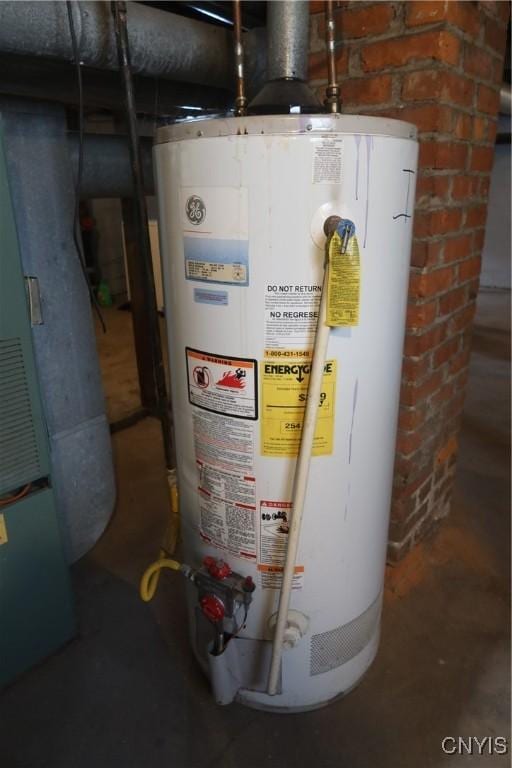 utility room featuring water heater