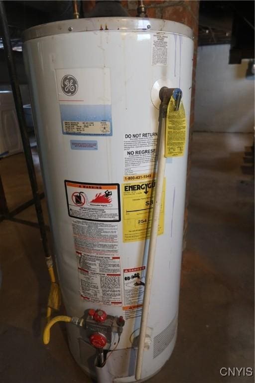 utility room featuring water heater