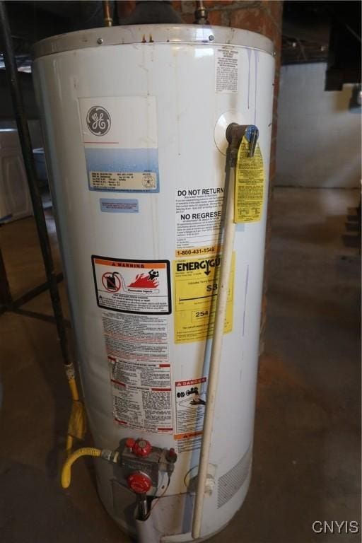 utility room featuring gas water heater