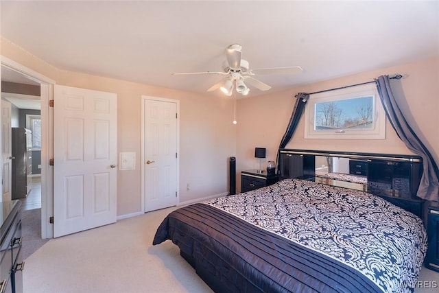 bedroom featuring carpet floors, ceiling fan, and baseboards