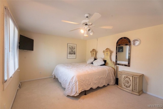 bedroom with carpet floors, baseboards, and a ceiling fan