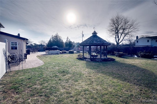 view of yard featuring a gazebo, a patio area, and fence