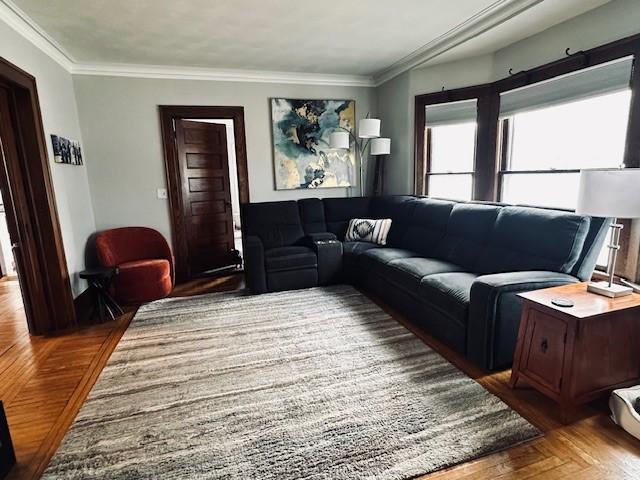 living area with crown molding