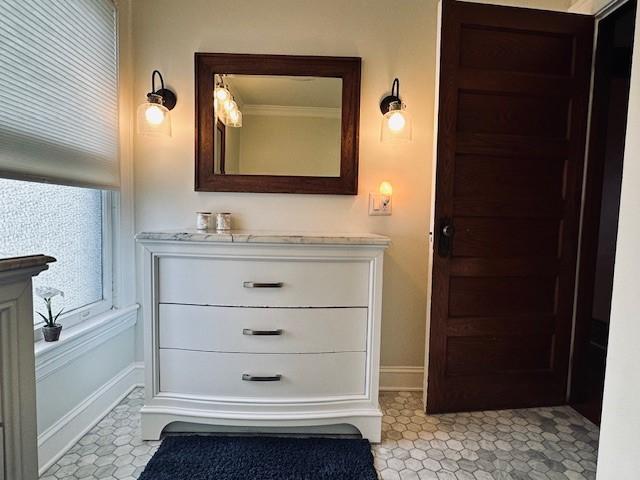 bathroom featuring baseboards and vanity