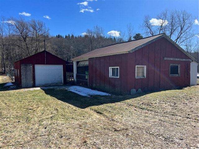 exterior space featuring an outbuilding and driveway