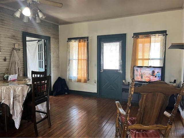 dining space with hardwood / wood-style flooring and ceiling fan