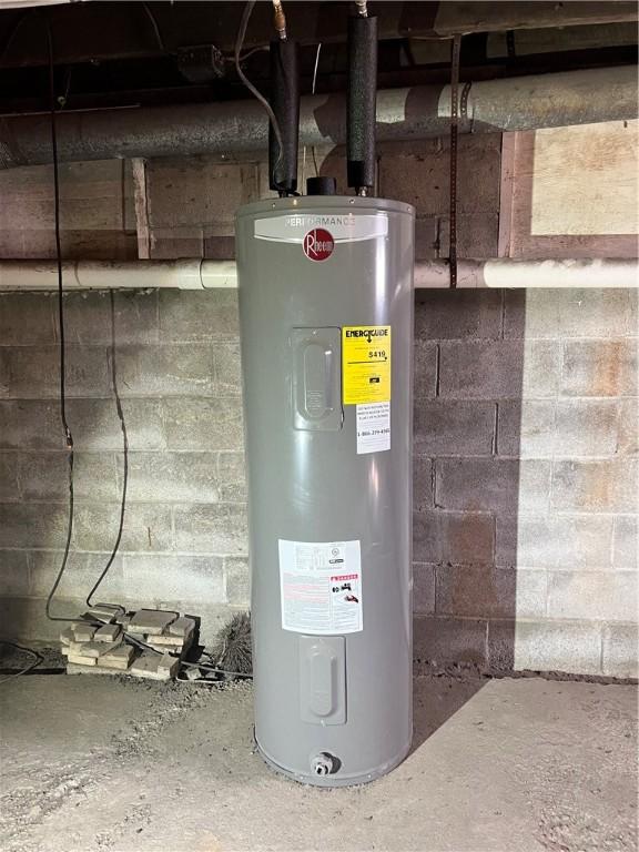 utility room with electric water heater