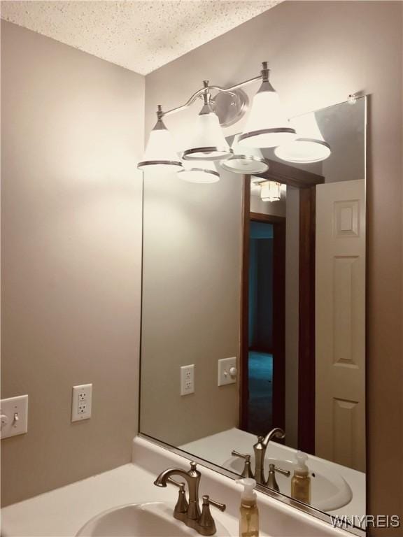 bathroom featuring vanity and a textured ceiling