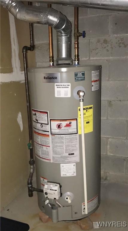 utility room featuring gas water heater