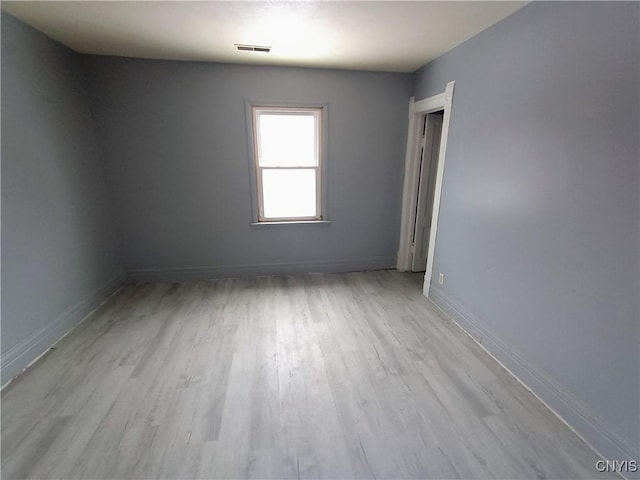 812 Kirkpatrick St, Syracuse, NY 13208 - unfurnished room with visible vents, baseboards, and wood finished floors