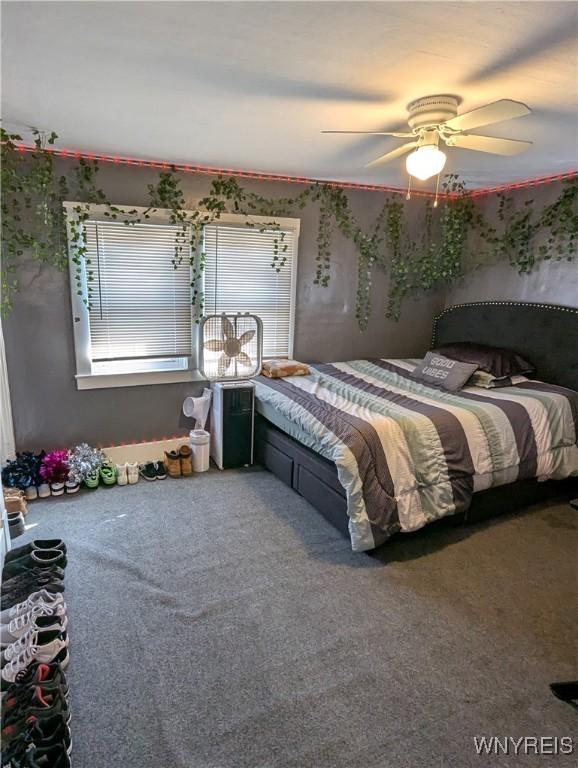 bedroom with carpet flooring and a ceiling fan