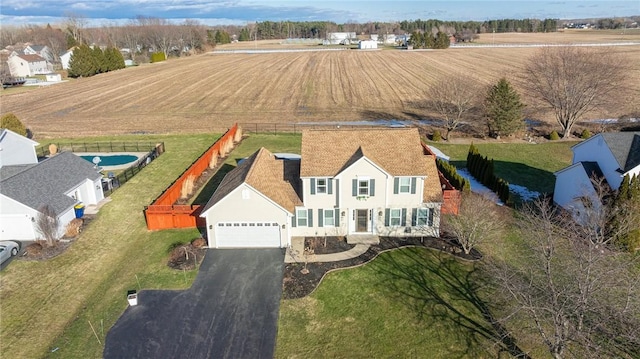 birds eye view of property with a rural view