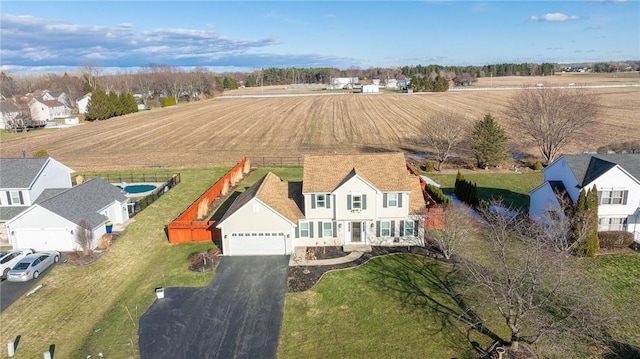 aerial view featuring a residential view and a rural view