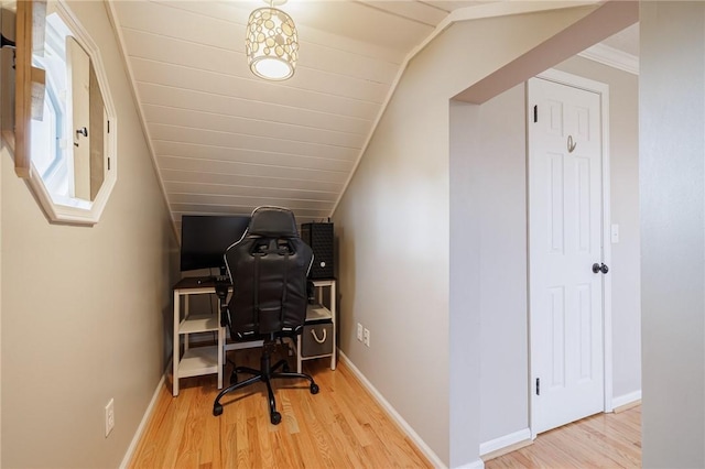 home office with vaulted ceiling, baseboards, and wood finished floors