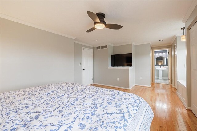 unfurnished bedroom featuring light wood finished floors, visible vents, baseboards, and ornamental molding