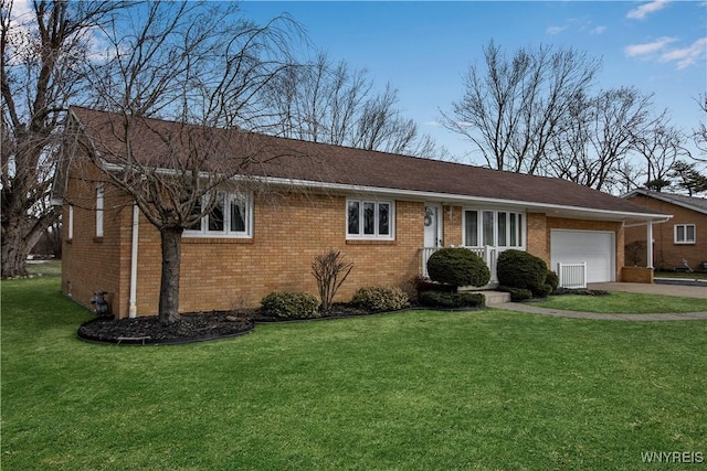 ranch-style house with a garage, driveway, brick siding, and a front lawn