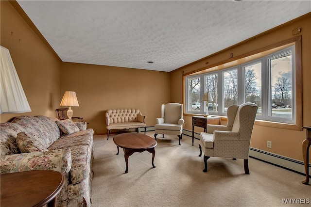 living room with a baseboard heating unit, carpet, and baseboards