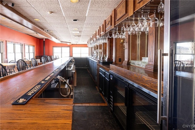 bar featuring a paneled ceiling