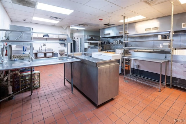 kitchen with a paneled ceiling and visible vents