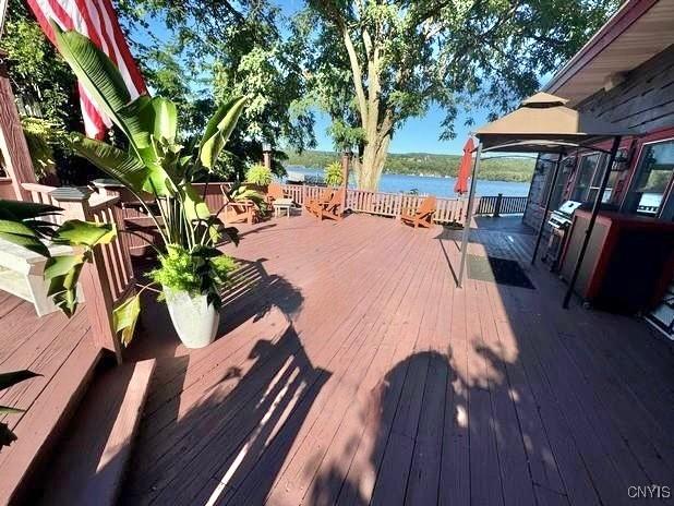 wooden deck featuring a water view