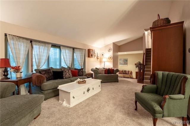 living room featuring light carpet, stairs, and lofted ceiling