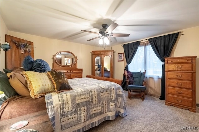 bedroom with light colored carpet and ceiling fan