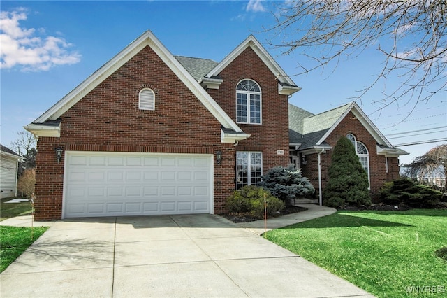 traditional-style home with brick siding, a shingled roof, a front lawn, concrete driveway, and a garage