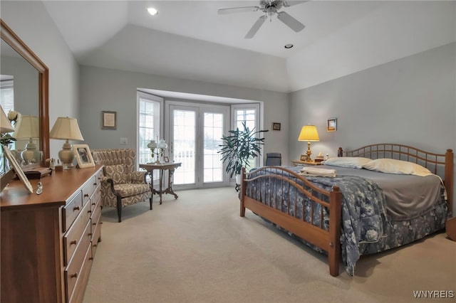 carpeted bedroom with lofted ceiling, access to exterior, recessed lighting, and a raised ceiling