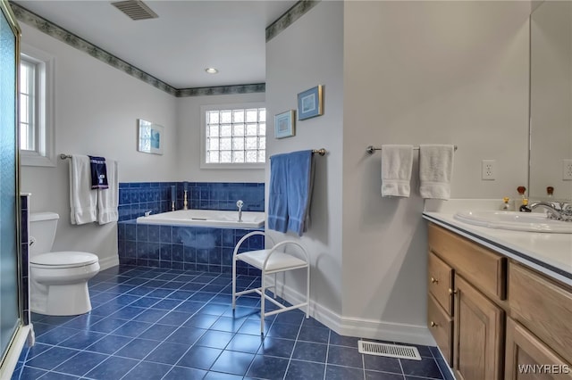 bathroom with visible vents, toilet, vanity, and tile patterned flooring