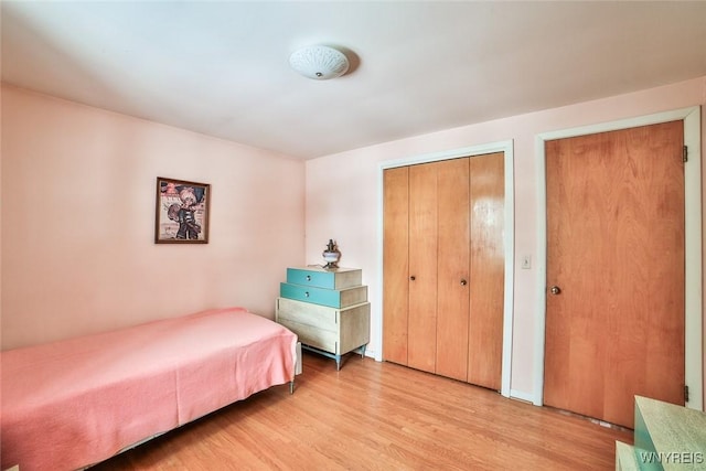 bedroom with light wood-style floors