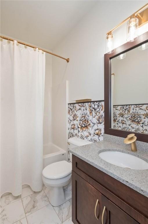 bathroom with vanity, toilet, marble finish floor, and shower / tub combo with curtain