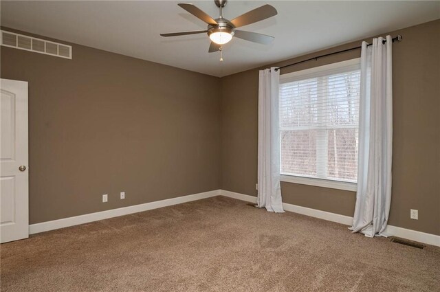 unfurnished room featuring visible vents, ceiling fan, baseboards, and carpet floors