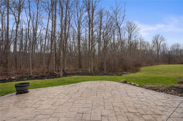 view of patio with a view of trees