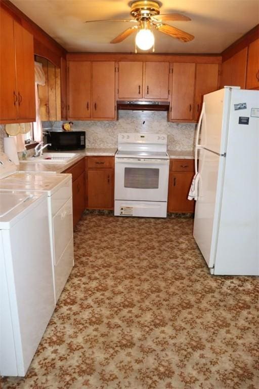 kitchen featuring white appliances, a ceiling fan, light countertops, under cabinet range hood, and backsplash