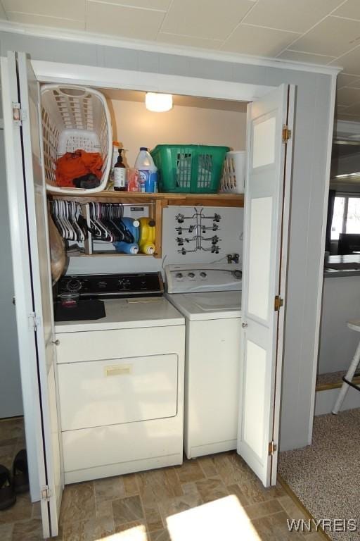 washroom featuring laundry area and washing machine and dryer