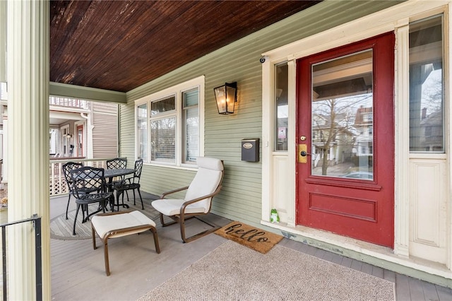 view of exterior entry featuring a porch