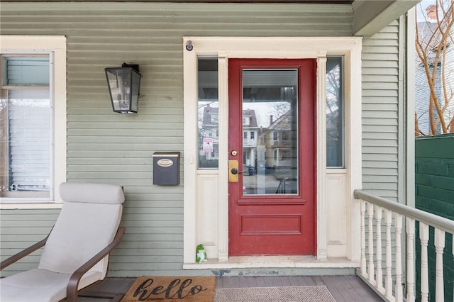 property entrance featuring covered porch